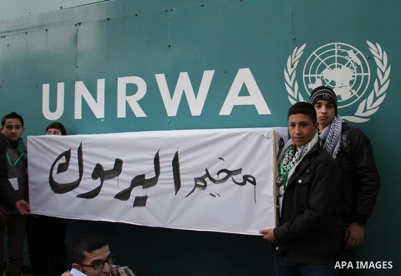 Palestinian children take part in a protest to show solidarity with Palestinian refugees in Syria's main refugee camp Yarmouk, in Gaza City on January 19, 2014. Photo by Ashraf Amra