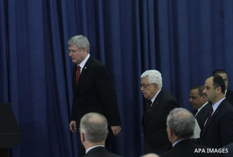 Palestinian President Mahmoud Abbas, right and Canadian Prime Minister Stephen Harper attend a joint press conference at Abbas's headquarters, in the West Bank city of Ramallah, Monday, Jan. 20, 2014. Harper is on a four...