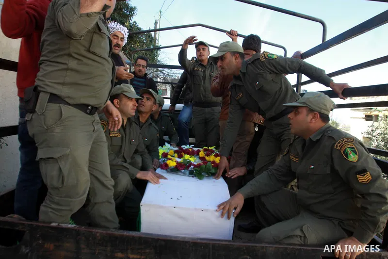 Palestinian security men carry the coffin of Majdi Khanfar, a Palestinian militant who was reportedly killed by Israeli forces during fighting ten years ago, during his reburial in the village of Silat al-Zaher near the...