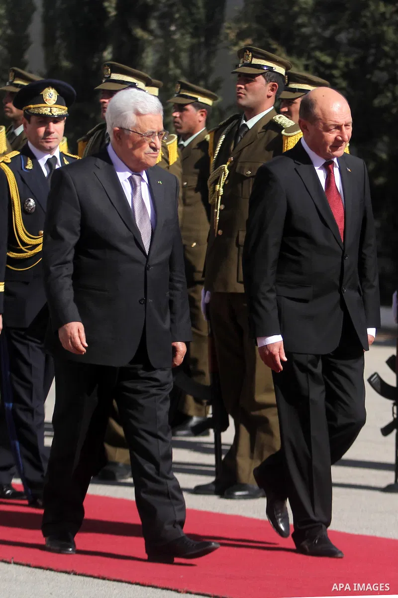 President of Romania Traian Basescu and Palestinian President Mahmoud Abbas, review the honor guards during the welcome ceremony in West bank town of Ramallah, 21 January 2014. Basescu arrives for a meeting with the Pale...