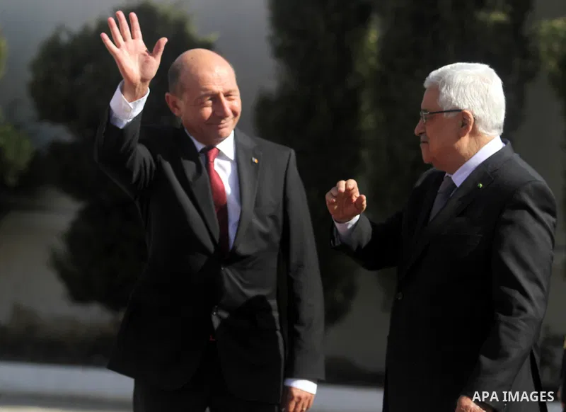 President of Romania Traian Basescu and Palestinian President Mahmoud Abbas, review the honor guards during the welcome ceremony in West bank town of Ramallah, 21 January 2014. Basescu arrives for a meeting with the Pale...