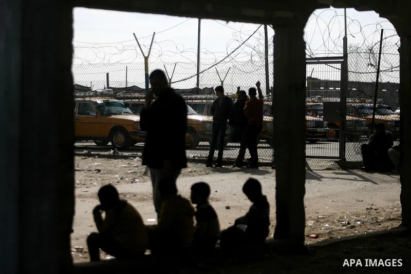 Palestinians, hoping to cross into Egypt, wait at the Rafah crossing between Egypt and the southern Gaza Strip January 21, 2014. Egyptian authorities partially opened the Rafah crossing, Gaza's main window to the world,...