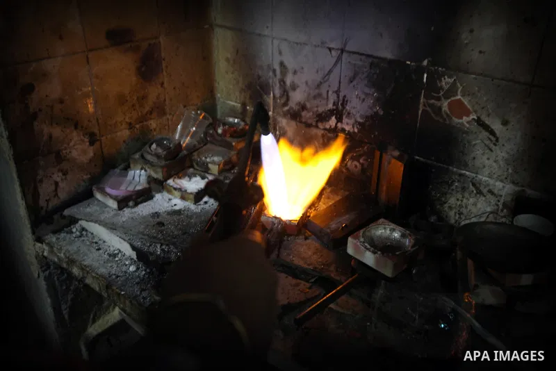 A Palestinian worker melts gold at his workshop in the village of Tarshiha, north Acre on January 21, 2014. Tarshiha was in the territory allotted to the Arab state under the 1947 UN Partition Plan. However, in the 1948...
