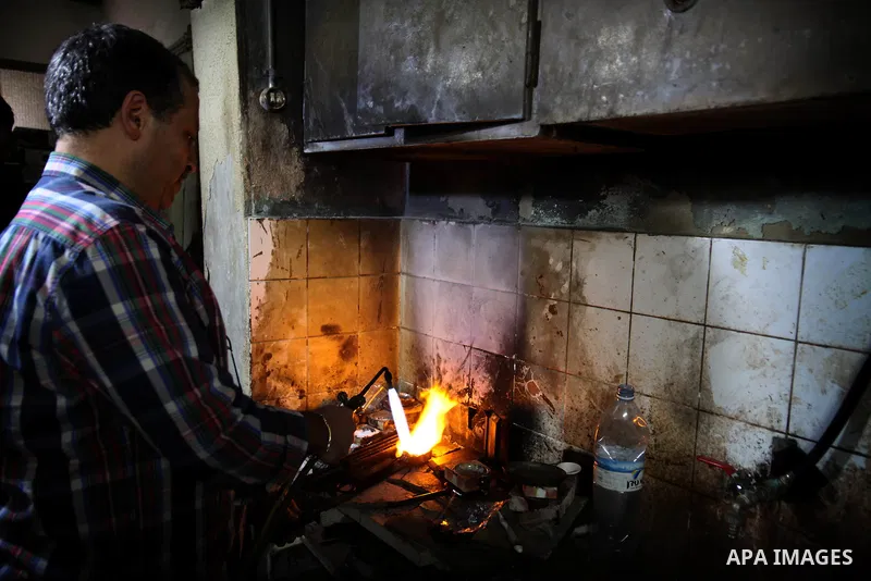 A Palestinian worker melts gold at his workshop in the village of Tarshiha, north Acre on January 21, 2014. Tarshiha was in the territory allotted to the Arab state under the 1947 UN Partition Plan. However, in the 1948...