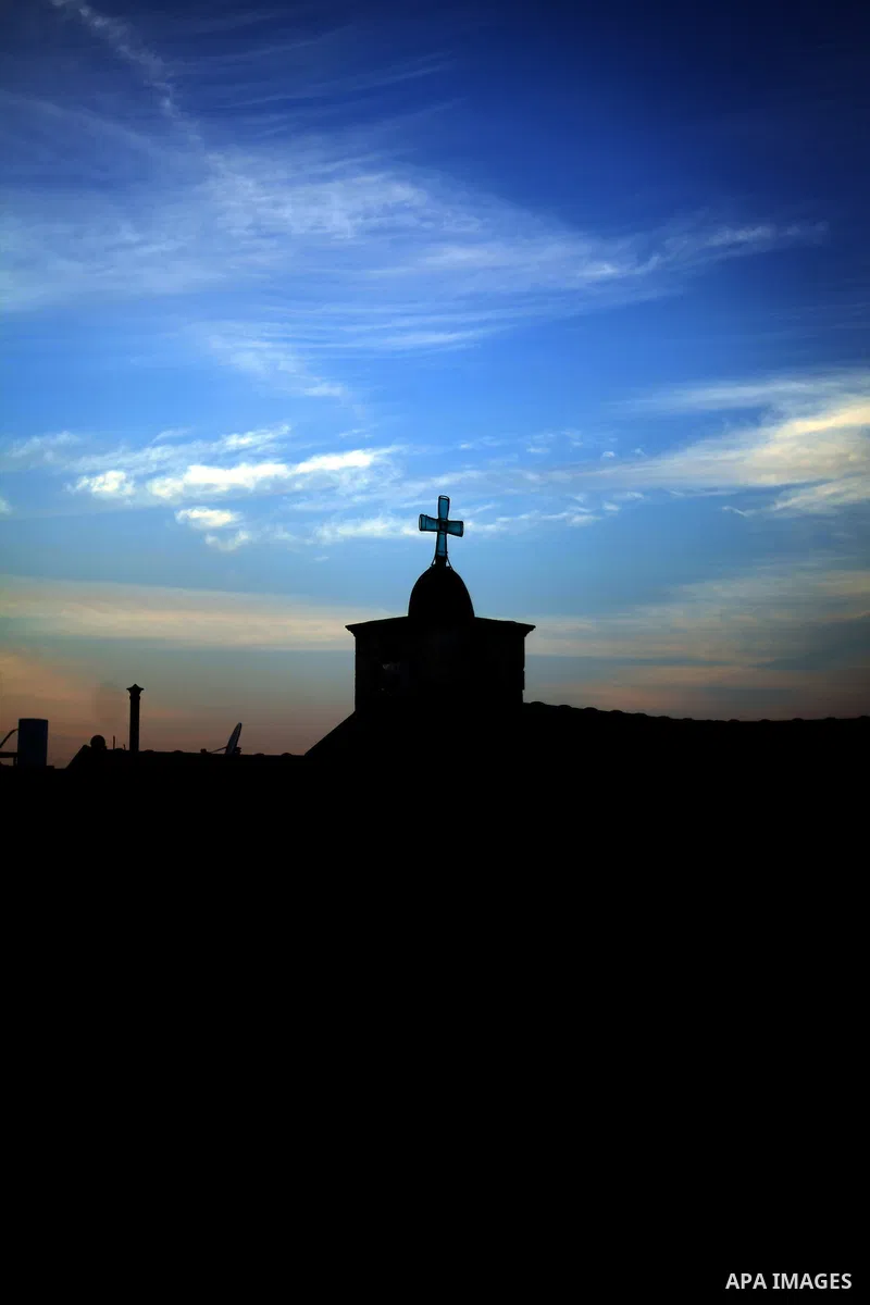 The cross of the Roman Catholic Church is seen during the sunset in the village of Tarshiha, north Acre on January 21, 2014. Tarshiha was in the territory allotted to the Arab state under the 1947 UN Partition Plan. Howe...