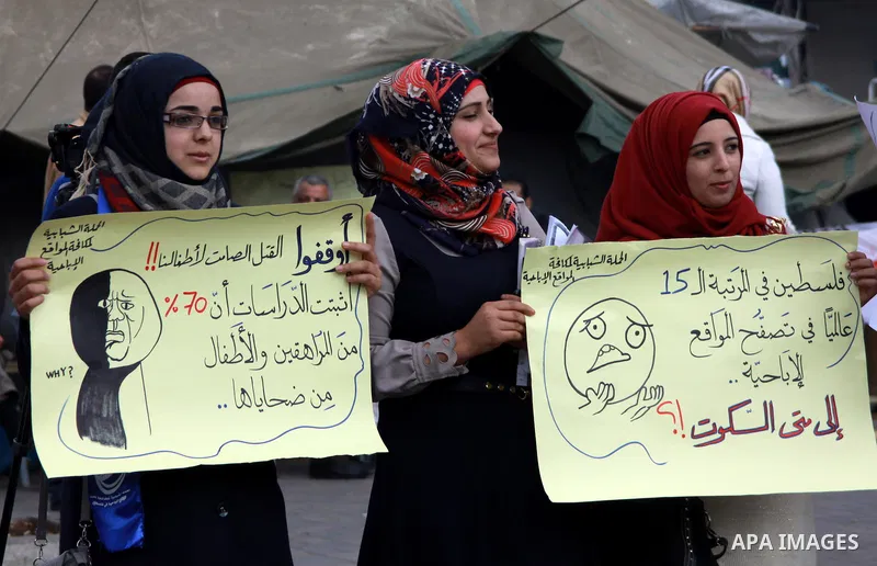 Palestinian students of the al-Najah University take part in a demonstration against the publication of porn movies on the Web sites in the West Bank city of Nablus, on, Jan. 23, 2014. Photo by Nedal Eshtayah