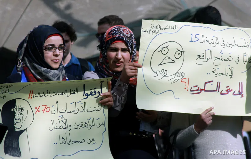 Palestinian students of the al-Najah University take part in a demonstration against the publication of porn movies on the Web sites in the West Bank city of Nablus, on, Jan. 23, 2014. Photo by Nedal Eshtayah