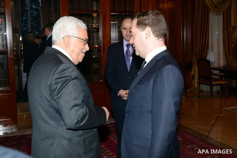 Russian Prime Minister Dmitry Medvedev (R) meets with Palestinian President Mahmoud Abbas (L) in the Gorki residence outside Moscow, Russia, Thursday, Jan. 23, 2014. Photo by Thaer Ganaim