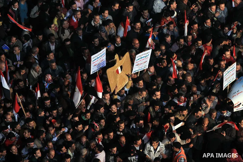 Supporters of Egypt's army and police gather at Tahrir square in Cairo, on the third anniversary of Egypt's uprising, January 25, 2014. Twenty-nine people were killed during anti-government marches on Saturday while thou...