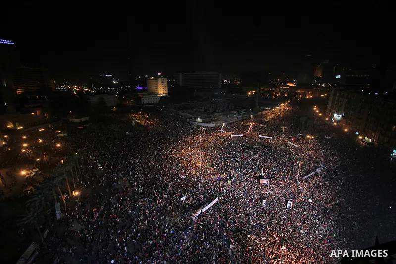 Supporters of Egypt's army and police gather at Tahrir square in Cairo, on the third anniversary of Egypt's uprising, January 25, 2014. Twenty-nine people were killed during anti-government marches on Saturday while thou...