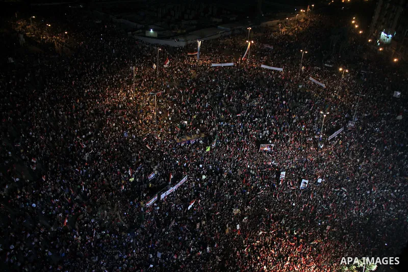 Supporters of Egypt's army and police gather at Tahrir square in Cairo, on the third anniversary of Egypt's uprising, January 25, 2014. Twenty-nine people were killed during anti-government marches on Saturday while thou...