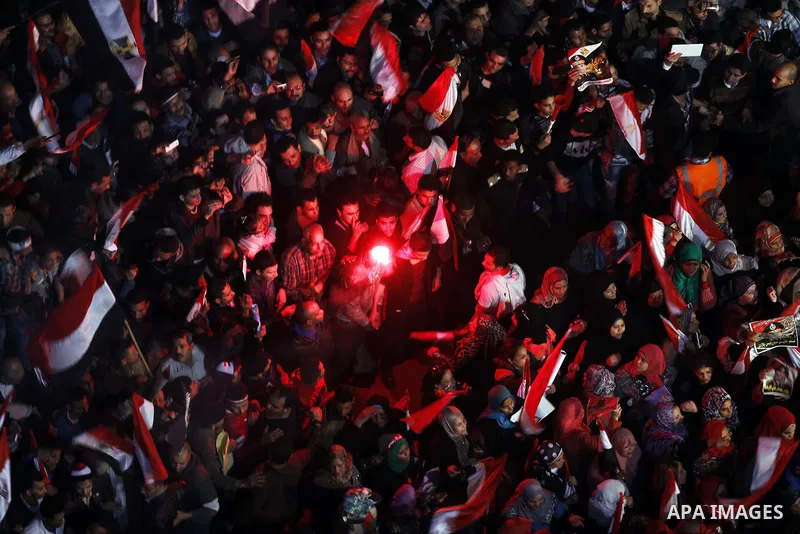 Supporters of Egypt's army and police gather at Tahrir square in Cairo, on the third anniversary of Egypt's uprising, January 25, 2014. Twenty-nine people were killed during anti-government marches on Saturday while thou...