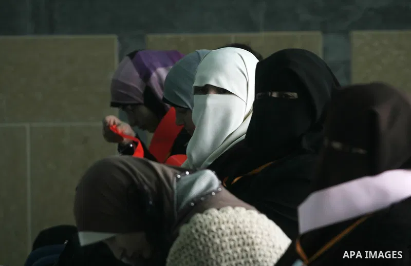Palestinian pilgrims wait at the Rafah border terminal in the southern Gaza Strip to cross into Egypt, on Jan. 26, 2014. Photo by Eyad Al Baba