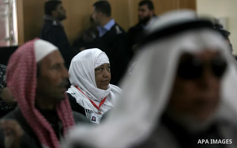 Palestinian pilgrims wait at the Rafah border terminal in the southern Gaza Strip to cross into Egypt, on Jan. 26, 2014. Photo by Eyad Al Baba
