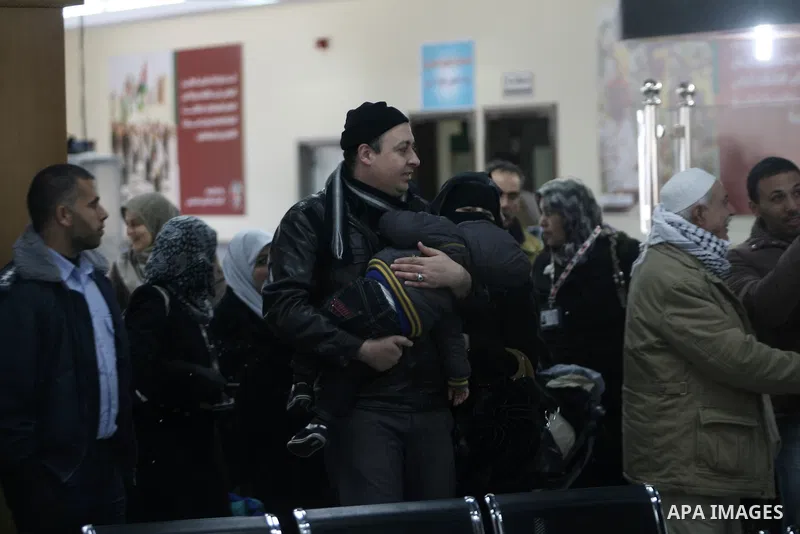 Palestinian pilgrims wait at the Rafah border terminal in the southern Gaza Strip to cross into Egypt, on Jan. 26, 2014. Photo by Eyad Al Baba