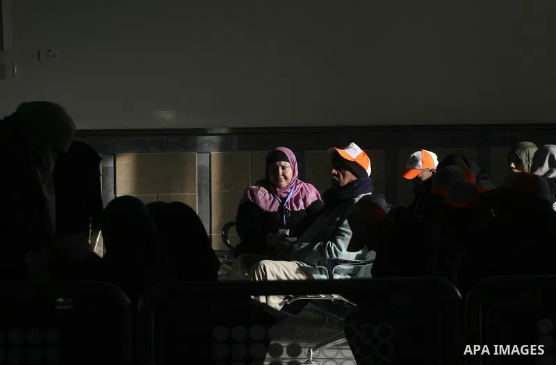 Palestinian pilgrims wait at the Rafah border terminal in the southern Gaza Strip to cross into Egypt, on Jan. 26, 2014. Photo by Eyad Al Baba