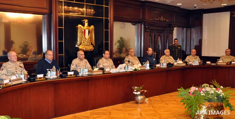 Egypt's army chief Field Marshal Abdel Fattah al-Sisi (C) attends a meeting with Egypt's army chief of staff Lieutenant General Sedki Sobhi at Egypt's military council headquarters in Cairo January 27, 2014. Egypt's top...
