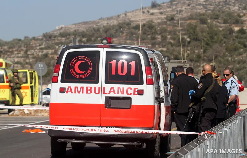 Israeli police men inspect the site of a fatal shooting incident next to the Palestinian village of Ein Sariya, north of the West Bank city of Ramallah January 29, 2014. Israeli soldiers killed Muhammad Mubarak, 21, on W...