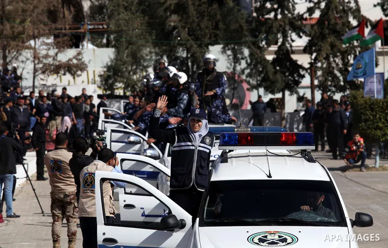 Palestinian policemen loyal to Hamas march during a graduation ceremony in Gaza City January 29, 2014. Photo by Ashraf Amra