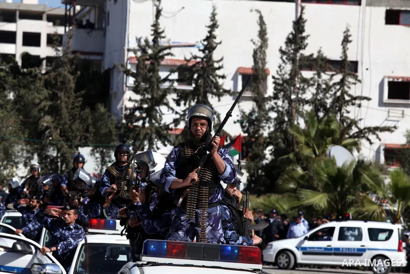 Palestinian policemen loyal to Hamas march during a graduation ceremony in Gaza City January 29, 2014. Photo by Ashraf Amra