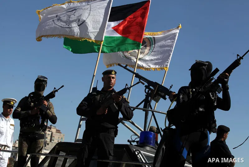 Palestinian policemen loyal to Hamas march during a graduation ceremony in Gaza City January 29, 2014. Photo by Ashraf Amra