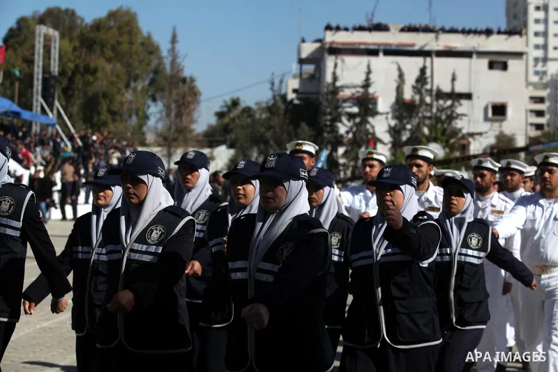 Palestinian policemen loyal to Hamas march during a graduation ceremony in Gaza City January 29, 2014. Photo by Ashraf Amra