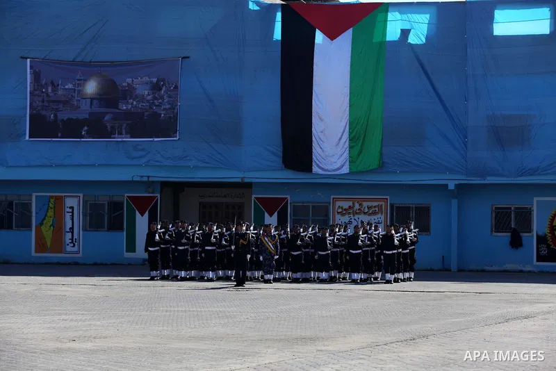 Palestinian policemen loyal to Hamas march during a graduation ceremony in Gaza City January 29, 2014. Photo by Ashraf Amra