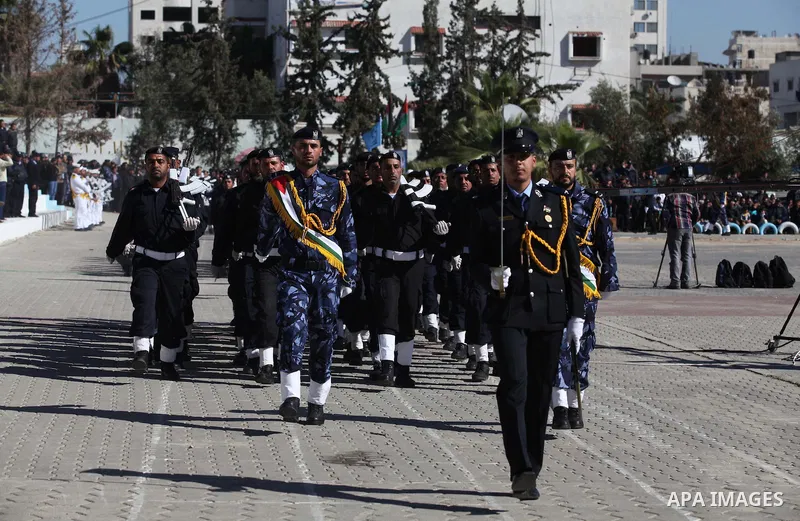 Palestinian policemen loyal to Hamas march during a graduation ceremony in Gaza City January 29, 2014. Photo by Ashraf Amra