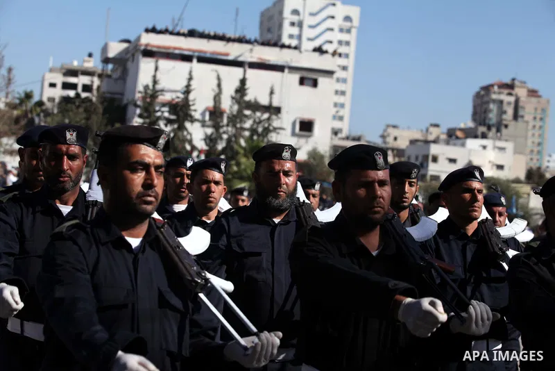 Palestinian policemen loyal to Hamas march during a graduation ceremony in Gaza City January 29, 2014. Photo by Ashraf Amra