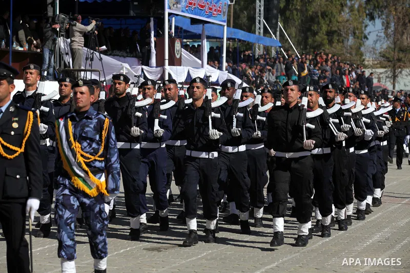 Palestinian policemen loyal to Hamas march during a graduation ceremony in Gaza City January 29, 2014. Photo by Ashraf Amra