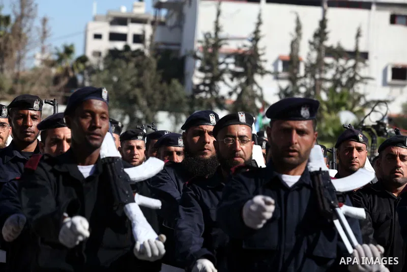 Palestinian policemen loyal to Hamas march during a graduation ceremony in Gaza City January 29, 2014. Photo by Ashraf Amra