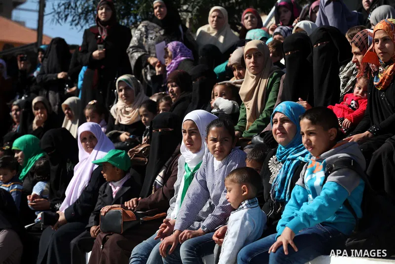 Palestinians attend a graduation ceremony of policemen loyal to Hamas in Gaza City January 29, 2014. Photo by Ashraf Amra