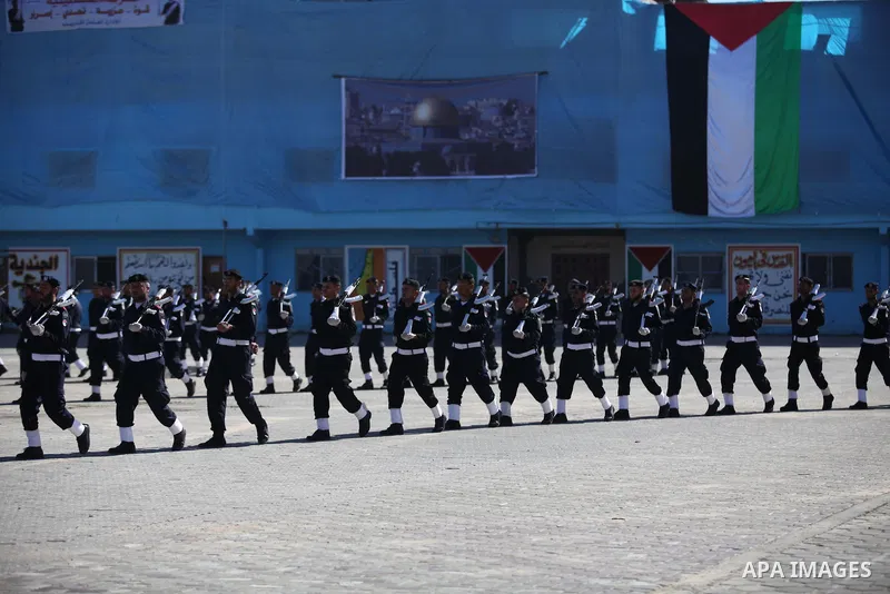 Palestinian policemen loyal to Hamas march during a graduation ceremony in Gaza City January 29, 2014. Photo by Ashraf Amra