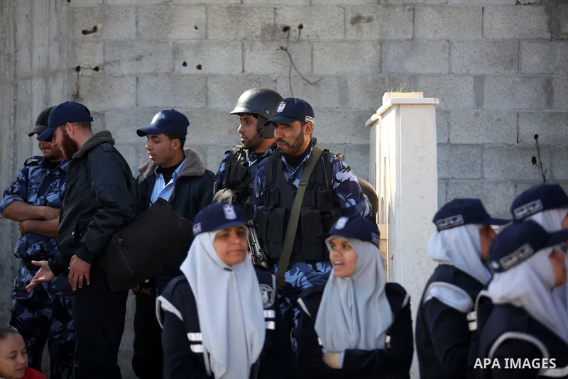 Palestinian policemen loyal to Hamas march during a graduation ceremony in Gaza City January 29, 2014. Photo by Ashraf Amra