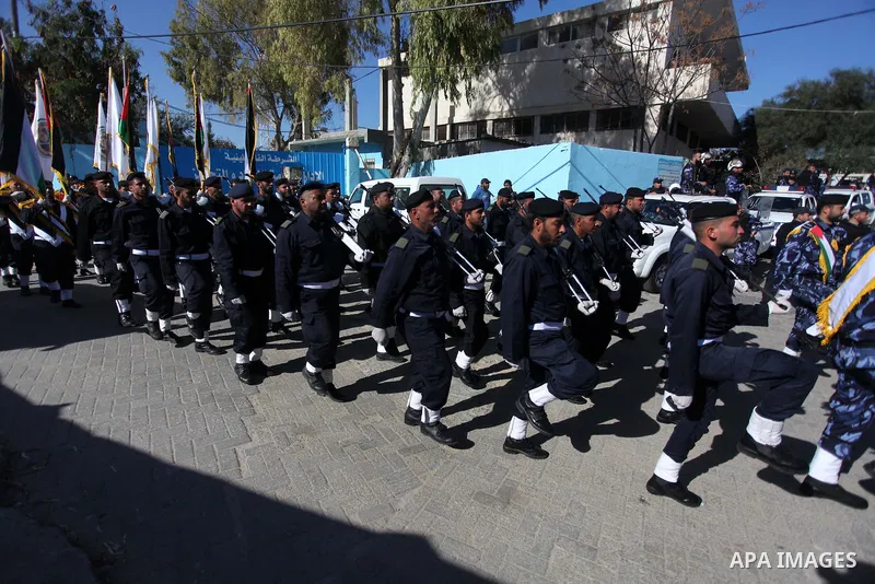 Palestinian policemen loyal to Hamas march during a graduation ceremony in Gaza City January 29, 2014. Photo by Ashraf Amra
