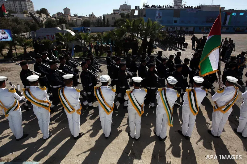 Palestinian policemen loyal to Hamas march during a graduation ceremony in Gaza City January 29, 2014. Photo by Ashraf Amra