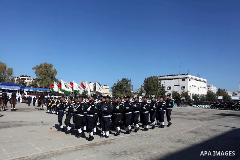 Palestinian policemen loyal to Hamas march during a graduation ceremony in Gaza City January 29, 2014. Photo by Ashraf Amra