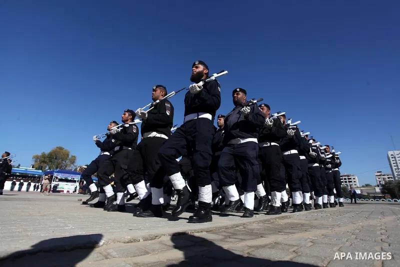 Palestinian policemen loyal to Hamas march during a graduation ceremony in Gaza City January 29, 2014. Photo by Ashraf Amra