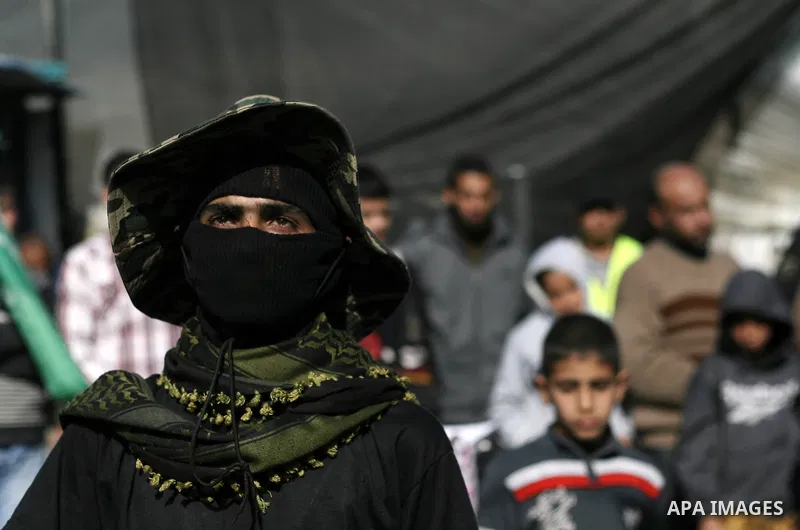 Palestinian supporters of Hamas movement take part in a demonstration in solidarity with refugees in Yarmouk refugee camp in Syria, in Khan Younis in the southern Gaza Strip January 31, 2014. Photo by Eyad Al Baba