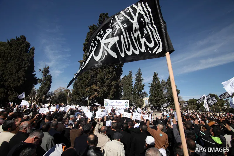 Palestinian supporters of Hizbut Tahrir, a conservative Islamic group shouts slogans during a rally in solidarity with Syrian revolution and against the Syrian President Bashar al-Asad, following Friday prayers at the Al...