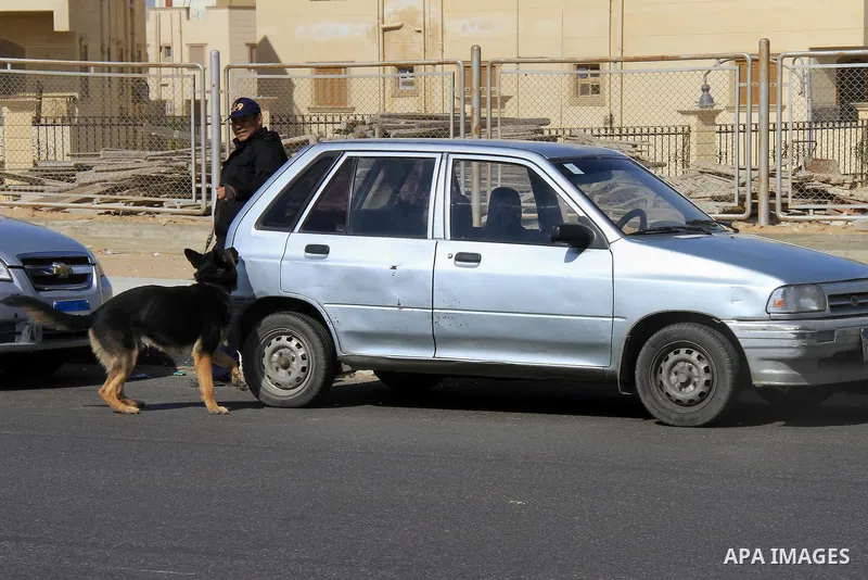 Egyptian soldiers guard outside a police academy, where the trial of ousted Egyptian President Mohamed Mursi and members of the Muslim Brotherhood is due to take place, on the outskirts of Cairo February 1, 2014. The pos...