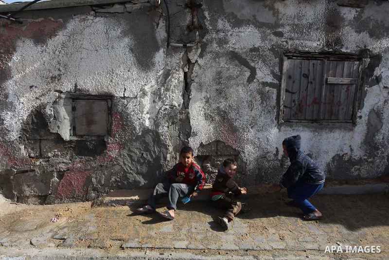Palestinian children play outside their family's houses at al-Shati refugee camp, in the west Gaza City on February 02, 2014. Photo by Ashraf Amra