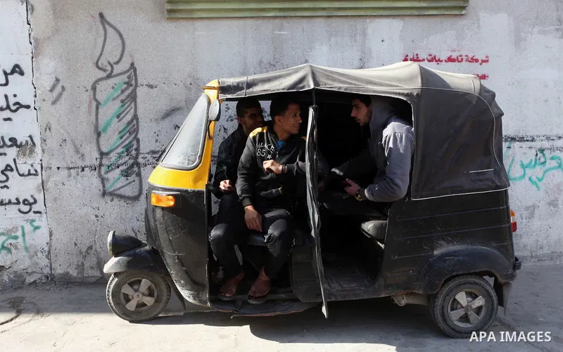 Young Palestinians ride a tricycle at al-Shati refugee camp, in the west Gaza City on February 02, 2014. Photo by Ashraf Amra