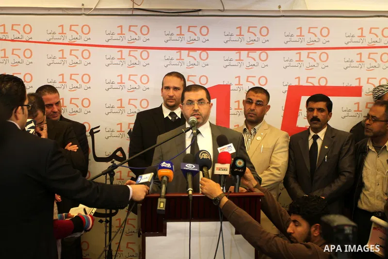 Palestinians attend the photo gallery organized by the International Committee of the Red Cross to mark the 150-year anniversary of its founding in Gaza City on Feb. 03, 2014. Photo by Mohammed Asad