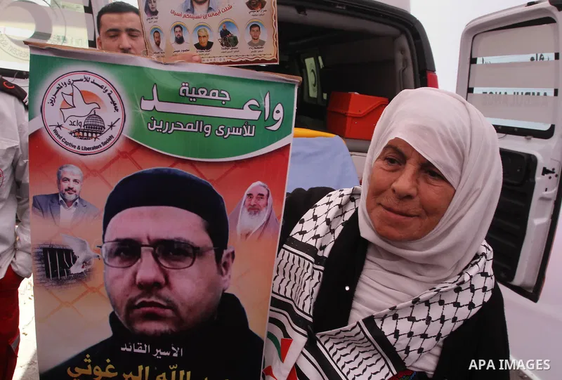 Palestinians take part in a protest demanding the release of their relatives prisoners held in Israeli jails, in front of the Red Cross office in Gaza City, on Feb. 03, 2014. Photo by Mohammed Asad
