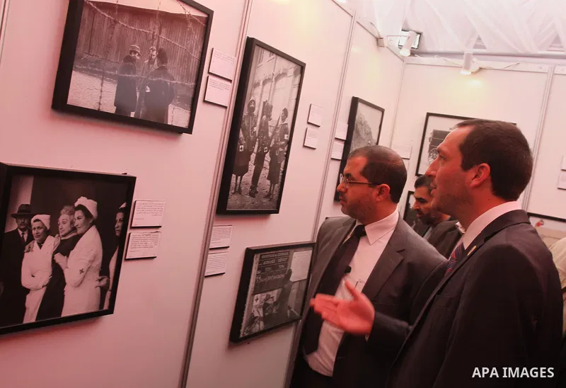 Palestinians attend the photo gallery organized by the International Committee of the Red Cross to mark the 150-year anniversary of its founding in Gaza City on Feb. 03, 2014. Photo by Mohammed Asad