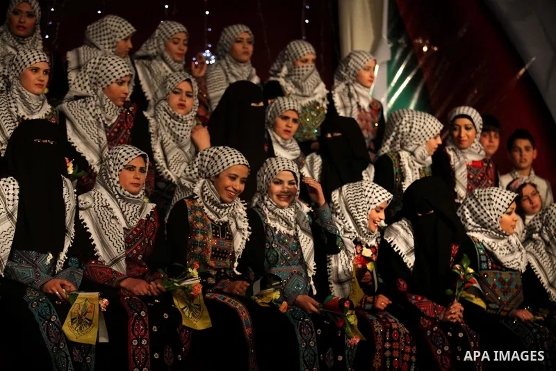 Palestinian brides take part in a mass wedding ceremony in Gaza City on February 04, 2014. Nearly 50 Palestinians were married in the Gaza Strip in a mass wedding funded by the office of Palestinian President Mahmoud Abb...