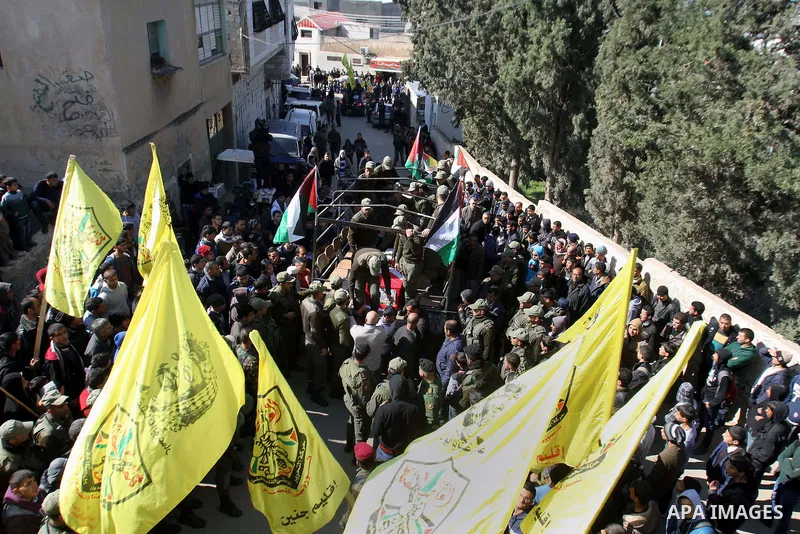 Palestinian security forces carry a coffin containing the remains of Jalal Mahameed, during a funeral in the West Bank City of Jenin, Feb. 05 , 2014. Israeli authorities handed over the remains of Jalal Mahameed, from th...