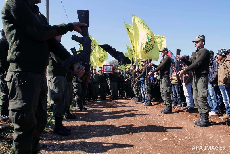 Palestinian security forces carry a coffin containing the remains of Jalal Mahameed, during a funeral in the West Bank City of Jenin, Feb. 05 , 2014. Israeli authorities handed over the remains of Jalal Mahameed, from th...