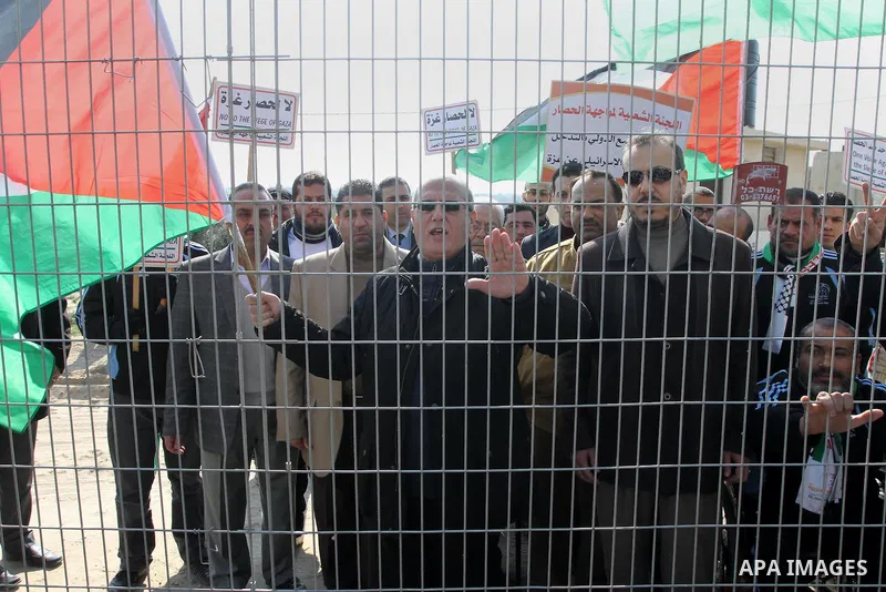 Palestinians take part in a protest against the Israeli blockade on Gaza, at Erez crossing between Israel and Gaza Strip Feb. 06, 2014. Israel imposed a blockade on Gaza in 2007 after Islamist group Hamas seized control...